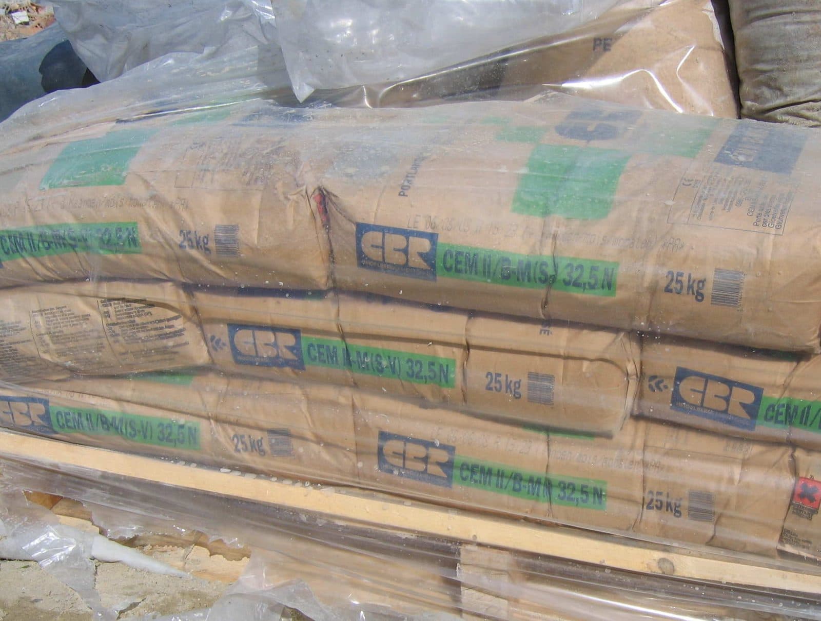 Stacks of paper cement bags on a pallet.