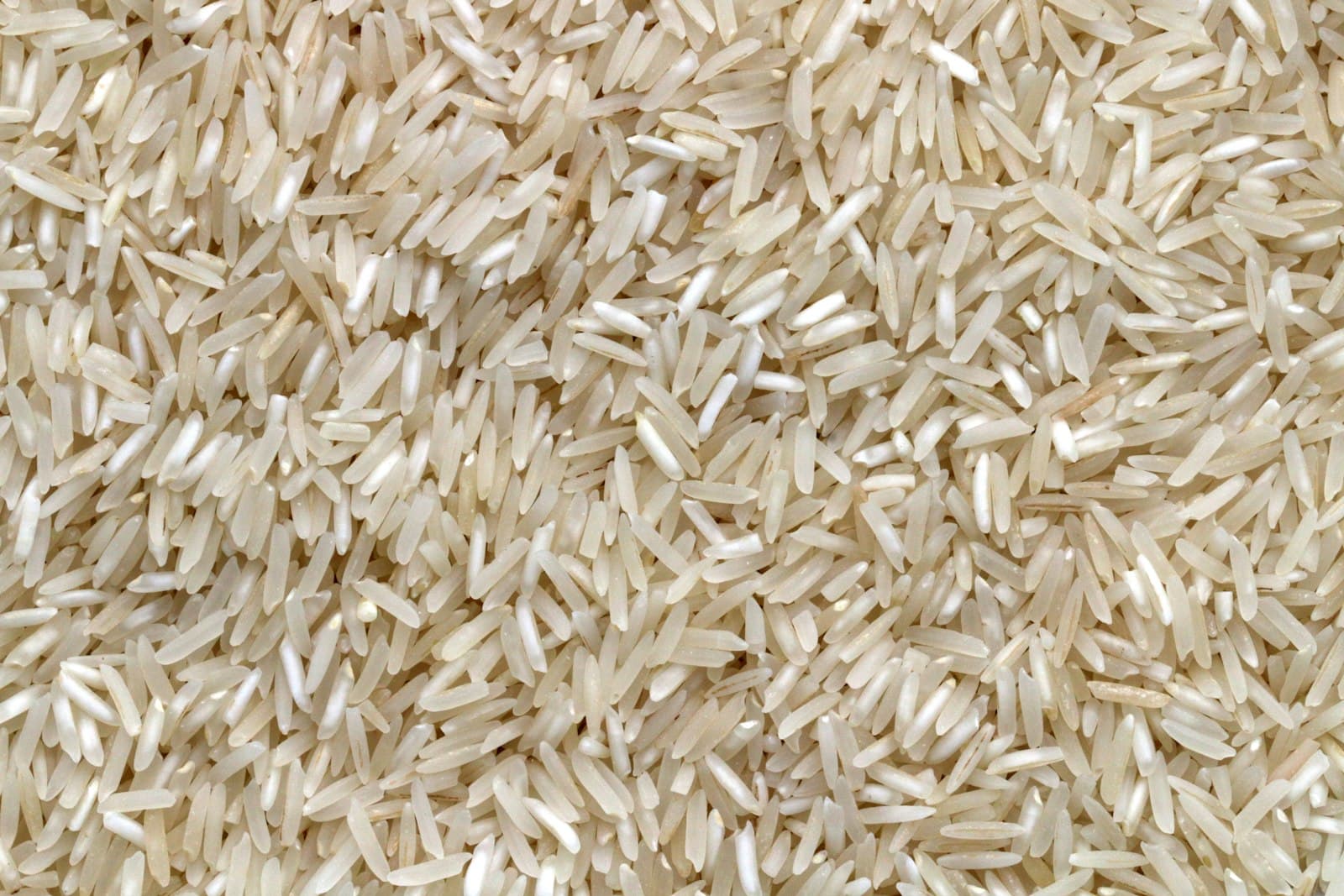 Uncooked white rice grains in a close view.